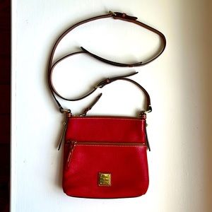 Dooney & Bourke Pebble Grain Letter Carrier In Red